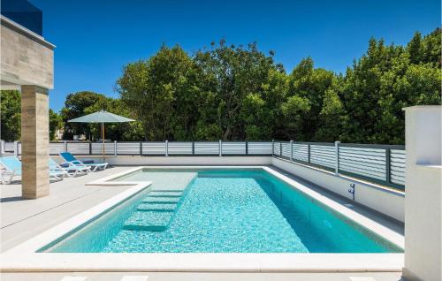 a swimming pool with blue water in a house at Villa Pervan in Pula