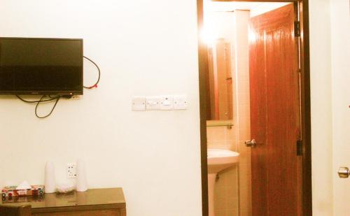 Hiltown Hotelにあるテレビまたはエンターテインメントセンター
