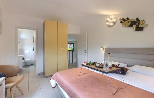 Ένα ή περισσότερα κρεβάτια σε δωμάτιο στο Villa Lora