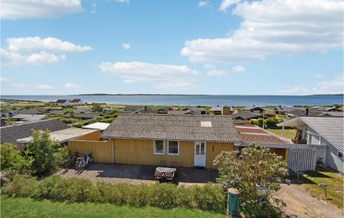an aerial view of a house with the ocean in the background at Awesome Home In Faaborg in Faaborg
