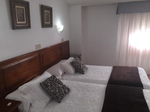Postel nebo postele na pokoji v ubytování Hotel Martin