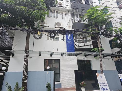 a building with a bunch of wires in front of it at Hotel Family Inn in Dhaka