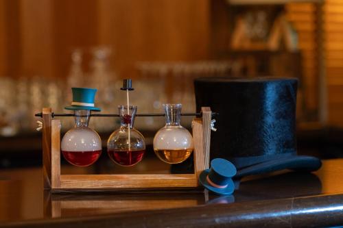 three bottles of alcohol in a wooden box on a table at Arctic Club Hotel in Seattle