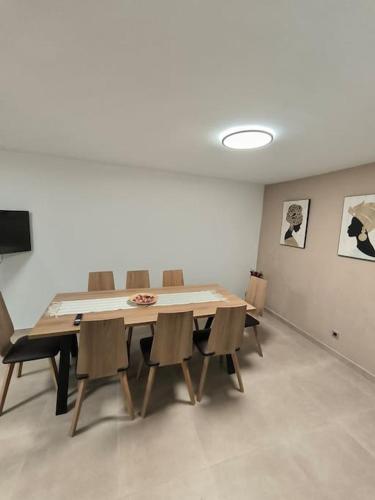 a dining room with a table and chairs in a room at Casa Otilia, Aventura y Relax in Buñol