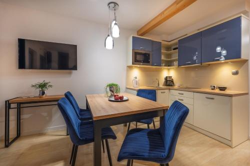 Кухня или мини-кухня в Apartamenty Gaja
