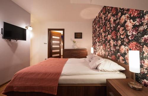 Кровать или кровати в номере Apartamenty Gaja