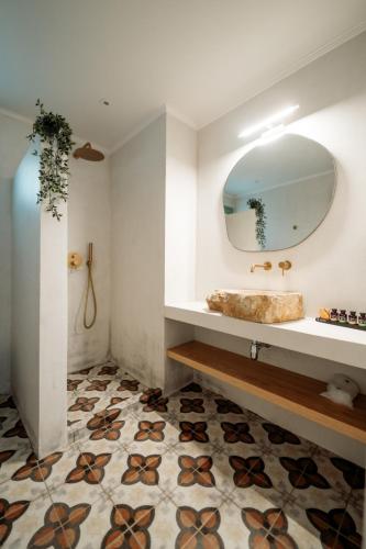 a bathroom with a sink and a mirror at Magnolia Villas Potos Thassos in Potos