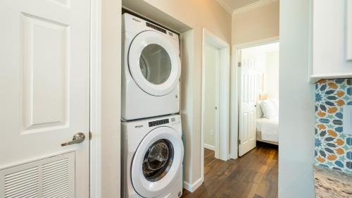 a laundry room with a washer and dryer at Mermaid Magic by Last Key Realty in Cudjoe Key