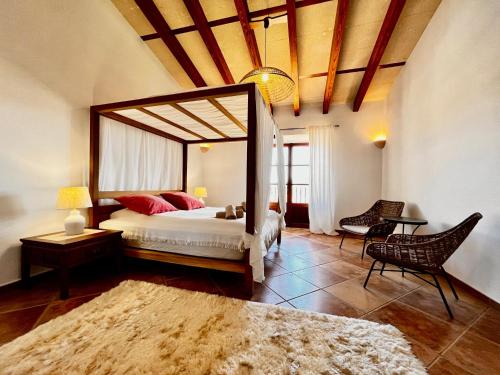 a bedroom with a large bed with a large mirror at Finca Reina de la isla in Felanitx