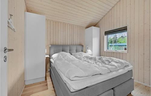 a large bed in a room with a window at Nice Home In Kalundborg With Wifi in Kalundborg