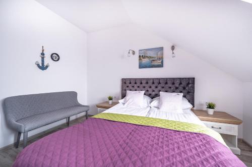 Кровать или кровати в номере Apartamenty Gaja