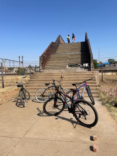 two bikes parked on the steps of some stairs at Authentic Bicycle Tours and Backpackers in Soweto