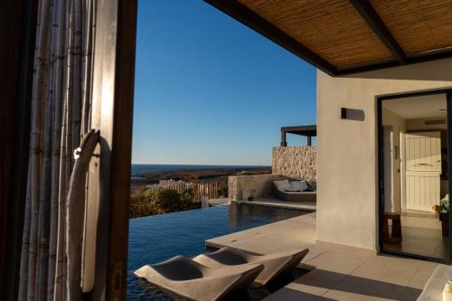 a view from the balcony of a house at Arpathea Villas in Foinikion