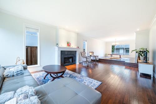 a living room with a couch and a fireplace at The Ester House in Vancouver