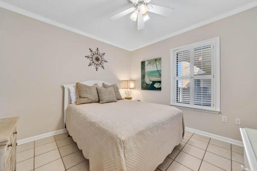 a bedroom with a bed and a ceiling fan at Phoenix 10 Unit 1514 in Orange Beach