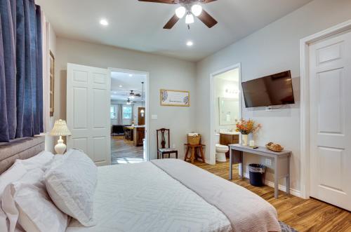 a bedroom with a bed and a living room at Pet-Friendly Tomball Home Walk to Main Street! in Tomball