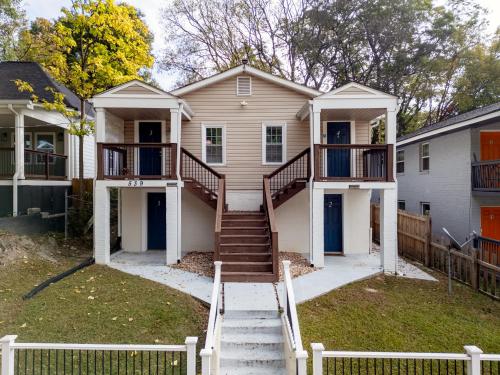 a house with stairs leading up to the front yard at Summerset Cottage Atlanta in Atlanta