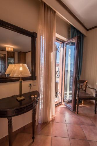 a room with a table and a window with a view at Marianna's Home Accommodation in Karpenision