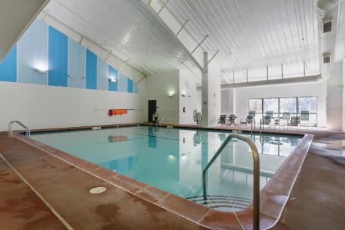 a large swimming pool in a building at Dog-Friendly A-Frame with Firepit and Fall Foliage in Hedgesville