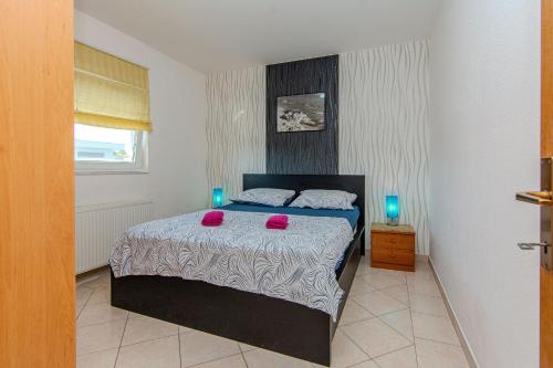 Ένα ή περισσότερα κρεβάτια σε δωμάτιο στο Apartments Markovic