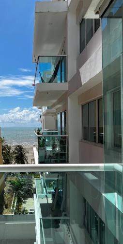 a balcony of a building with a view of the ocean at Morros 922 Beach House in Cartagena de Indias
