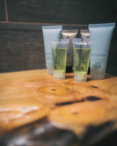 a group of four products on a wooden table at Entre Volcanes Lodge in Ensenada