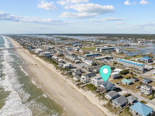 an aerial view of a beach with a green arrow at Parrotise in Surf City