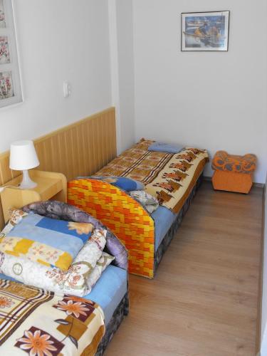 Postel nebo postele na pokoji v ubytování Siesta Üdülő
