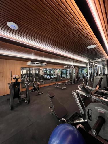 a gym with lots of cardio equipment in a building at Meu Resort Porto Alto in Cupe