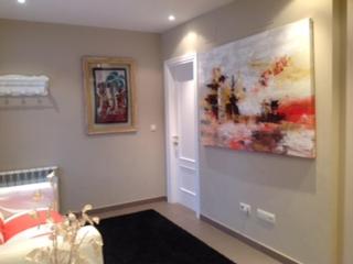 a room with a bed and a painting on the wall at Casa Campo in Abay