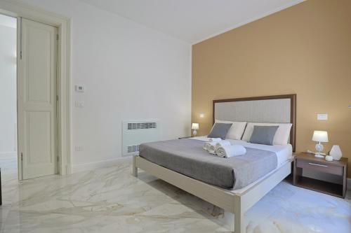 Postel nebo postele na pokoji v ubytování Palazzo Cavour