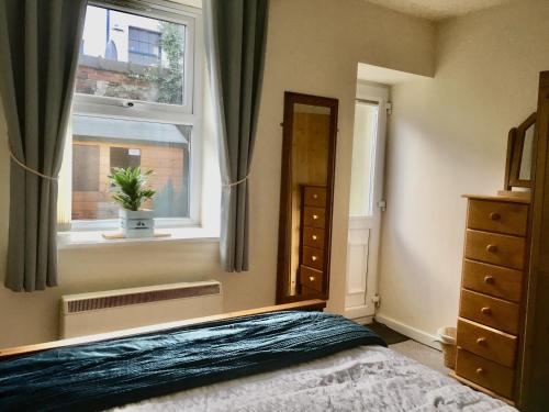 Ένα ή περισσότερα κρεβάτια σε δωμάτιο στο Chapel St Apartments