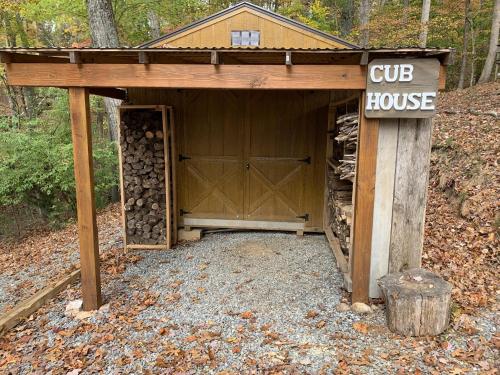 a building with a cup house in the woods at Bears Den at Acorn Dr. in Moneta