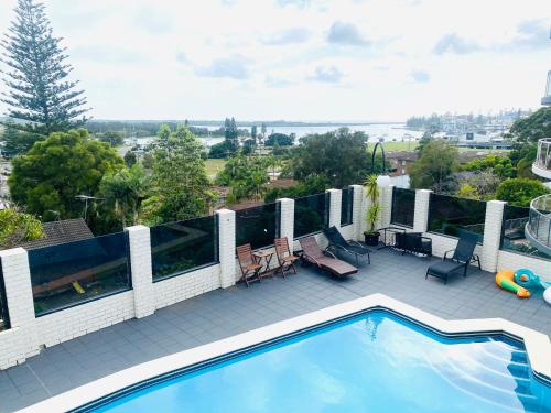 a view of a swimming pool on a balcony at Citadel Suite in Port Macquarie