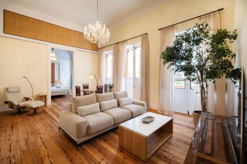 a living room with a couch and a table at Panasco Real Suite - Panasco Suites in Arrecife