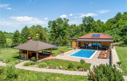 a house with a gazebo and a pool at Beautiful Home In Kelemen With Sauna in Kelemen