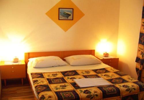 Postel nebo postele na pokoji v ubytování Apartments Nebo