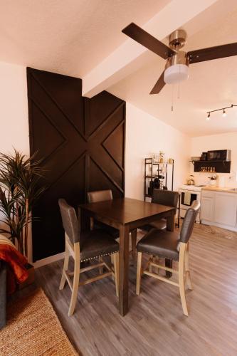 a dining room with a wooden table and chairs at Desert Watercolor Part 2 in Virgin