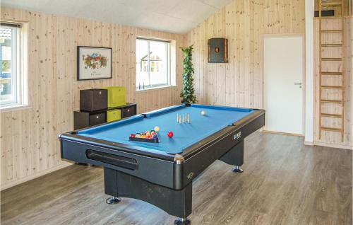 a billiard room with a blue pool table at Holiday Home Kronens Have Tranekær Iii in Hou