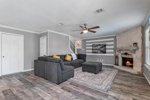 a living room with a couch and a fireplace at Retreat close to Lewisville Lake with pool, pet ok in Little Elm
