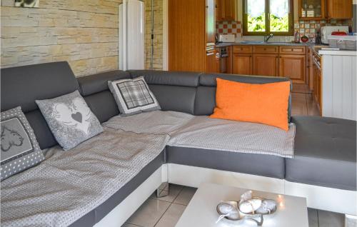 a couch with pillows and a table in a kitchen at Gorgeous Home In Blis Et Born in Blis-et-Born