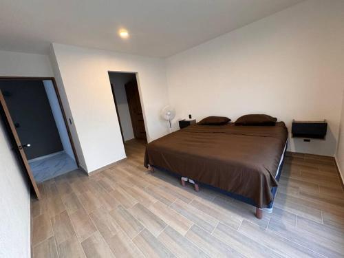 Ένα ή περισσότερα κρεβάτια σε δωμάτιο στο Casa Querétaro Facturamos