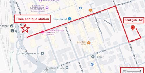 a map of the train and bus station at Central 2 bedroom apartment in Lillehammer