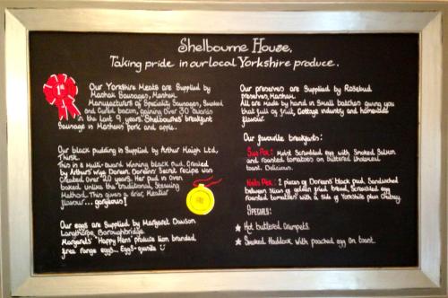 a menu on a blackboard in a restaurant at Shelbourne House in Harrogate