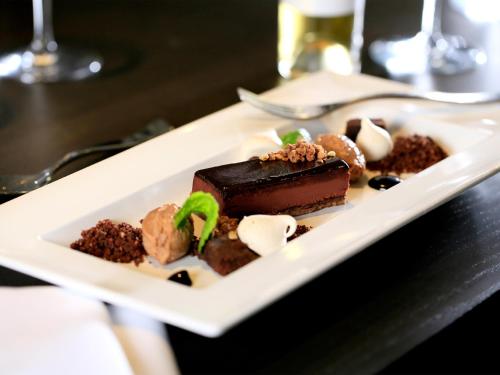 a plate of chocolate desserts on a table at Macdonald Berystede Hotel & Spa in Ascot