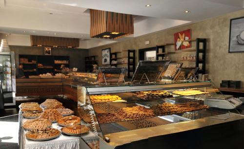 a bakery filled with lots of different types of pastries at Studiotel Afoud in Agadir