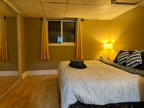 a bedroom with a bed and a window at The Rustic Barn in Brampton
