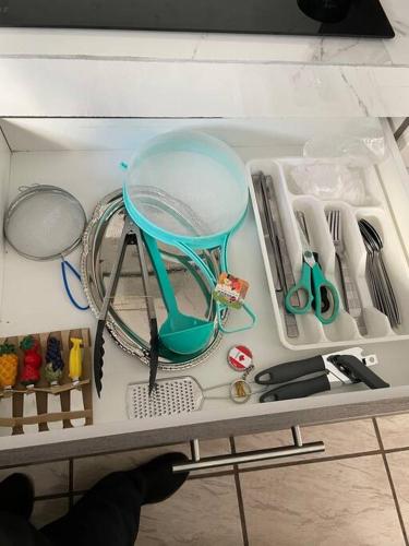 a drawer filled with kitchen utensils on a table at Jardines de Miraflores, Casa Remodelada completa zona sur ITESO TecMilenio UVM HP Colon Centro Sur in Guadalajara