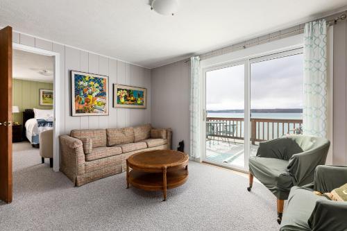 a living room with a couch and a table at Crystal Lake Serenity in Beulah