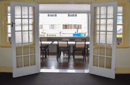 an open door to a dining room with a table at Grafton Hotel in Grafton